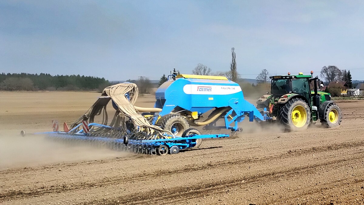 A Modern Tractor With A Sowing Machine When Planting Crops In A