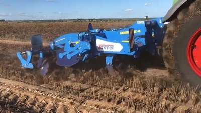 Digger working on very wet rice ground